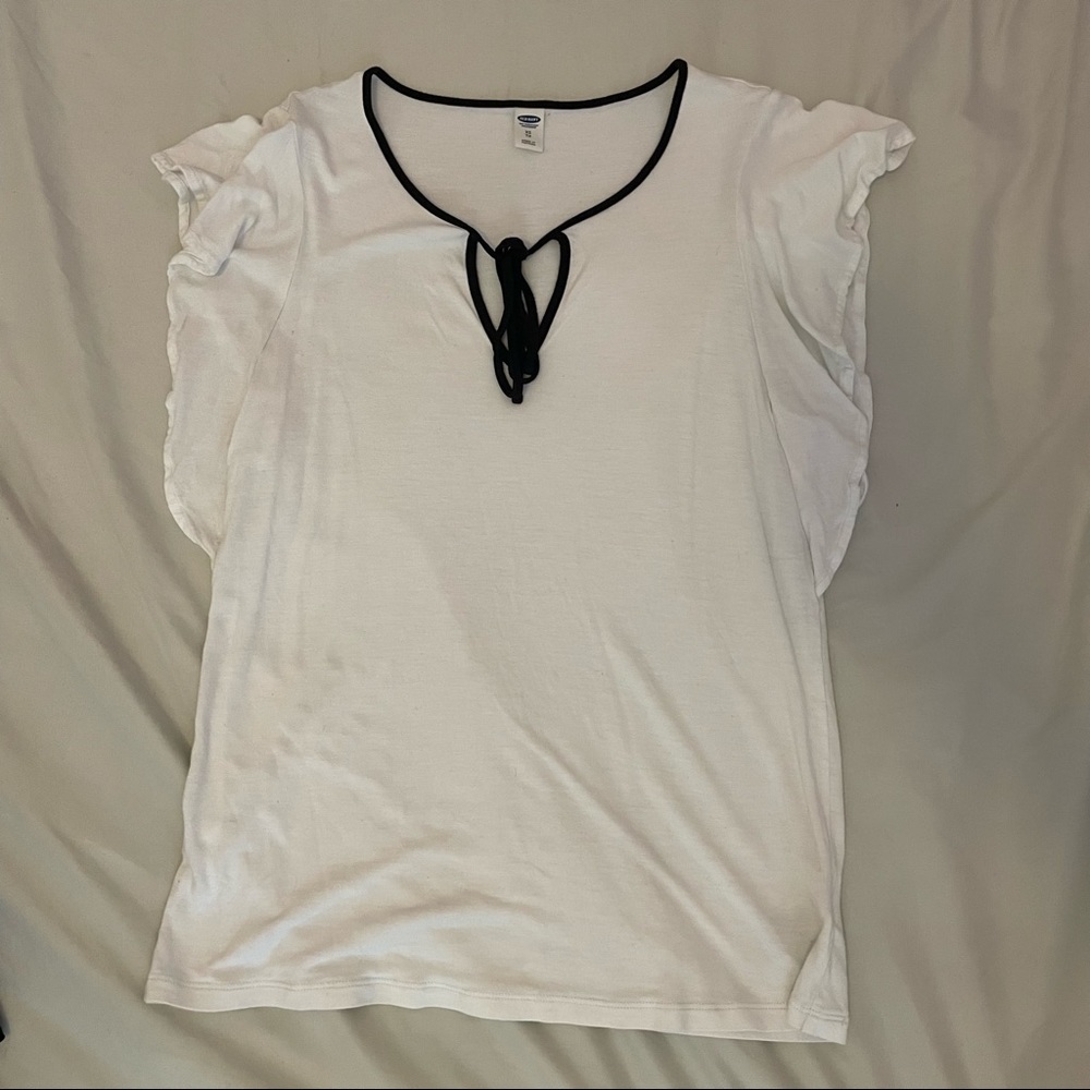 White blouse with black bow